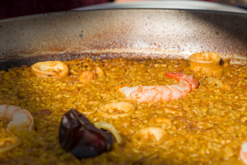 Red shrimps paella in paella pan Valencia Spain