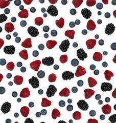 Berries pattern isolated on white. Strawberries, raspberries blackberries and blueberries arranged on white.