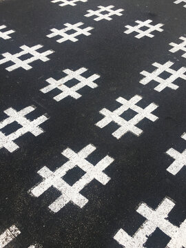 Has tag symbol on asphalt.A hashtag is a metadata tag that is prefaced by the hash symbol, #. Hashtags are widely used on microblogging and photo-sharing services 