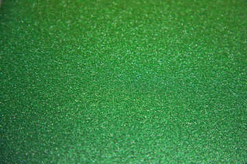 Green glittery shiny background with space to write your text 