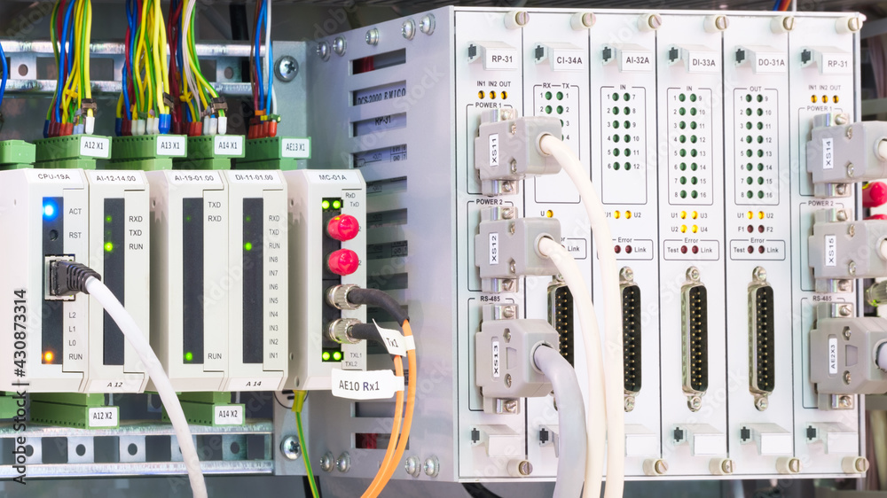 Poster View of communication port module on PLC unit in control box of automation machine