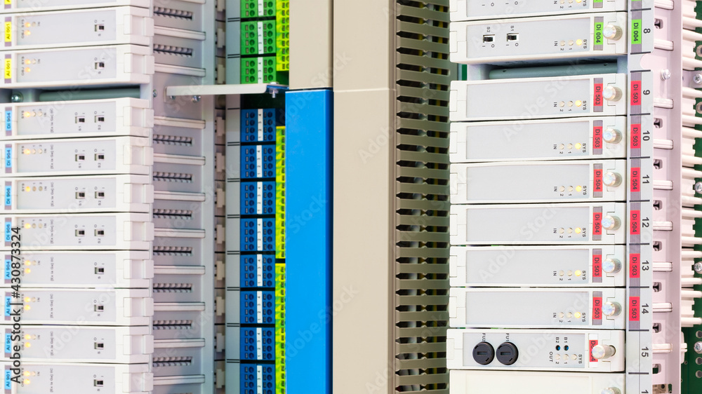 Leinwandbilder View of communication port module on PLC unit in control box of automation machine