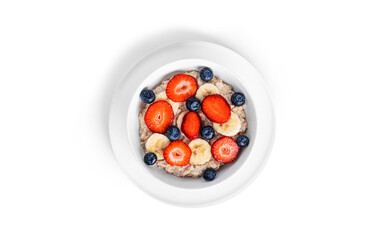 Oatmeal with fruit isolated on a white background. Oatmeal with strawberries, blueberries and banana.