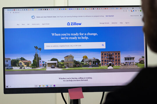 New York, USA - 26 April 2021: Zillow website page on screen, man using service, Illustrative Editorial.
