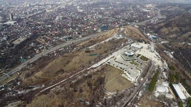 ALMATY, KAZAKHSTAN-03.07.2021: Kok Tobe Park in Almaty aerial view. Top view from the throne of Mount Kok Tobe in early spring