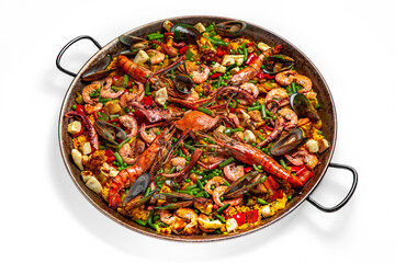 Paella. Huge frying pan. Spanish dish of rice and seafood, vegetables and chicken. Shrimp, octopus, crab and mussels. Banquet festive dishes. Gourmet restaurant menu. White background.