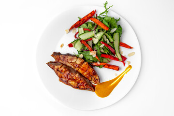 Roasted pike perch in sauce and vegetables. Banquet festive dishes. Gourmet restaurant menu. White background.
