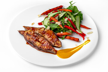 Roasted pike perch in sauce and vegetables. Banquet festive dishes. Gourmet restaurant menu. White background.