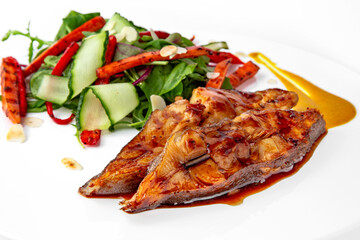 Roasted pike perch in sauce and vegetables. Banquet festive dishes. Gourmet restaurant menu. White background.