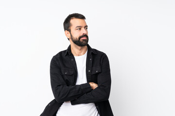 Young man with beard over isolated white background portrait