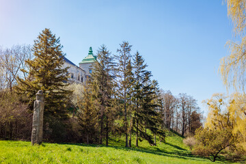 View of Olesko Castle from spring garden. Ancient architecture in Western Ukraine. Traveling in Lviv region