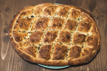 Homemade Ramadan pita. Sesame and black cumin bread. Handmade organic bread. Sesame pita. Homemade Turkish Pita Bread.
