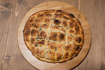 Homemade Ramadan pita. Sesame and black cumin bread. Handmade organic bread. Sesame pita. Homemade Turkish Pita Bread.