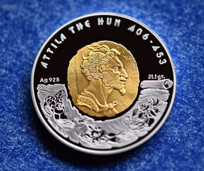 a portrait of Attila, king of the Huns, on a Kazakh coin
