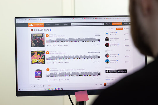 New York, USA - 26 April 2021: SoundCloud website page on screen, man using service, Illustrative Editorial.