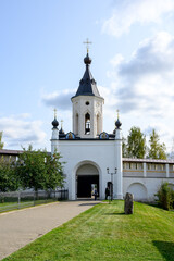 Fototapeta na wymiar South gate with a gate chapel in Staritsky Holy Dormition Monastery, Staritsa, Tver region, Russian Federation, September 20, 2020