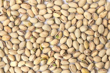 Roasted and salted pistachios in shell ( texture, background ). Top view, flat lay