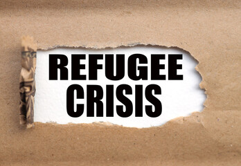 Obraz premium Refugee Crisis. Business concept. text on white paper, torn paper near the text.