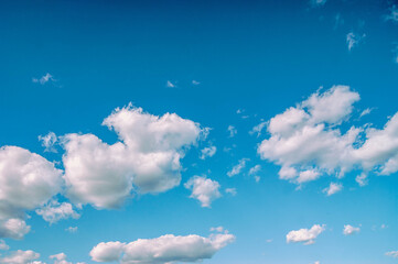 Blue sky with lots of thick clouds. Sky background. Stylized colors to give an entourage.