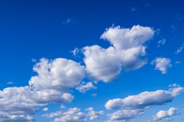 Obraz premium Blue sky with lots of thick clouds. Sky background. Stylized colors to give an entourage.