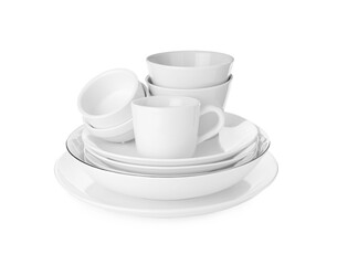 Stack of clean dishware isolated on white