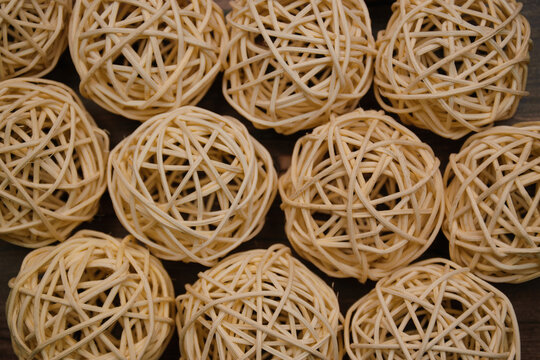 Background from a heap of straw light craft balls.
