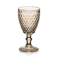 Glass transparent goblet for drinks on a white isolated background.