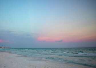 white sand on gulf beach at sunset