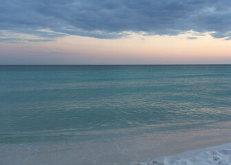 white sand on gulf beach at sunset