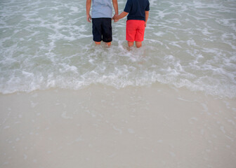 kids in water on beach