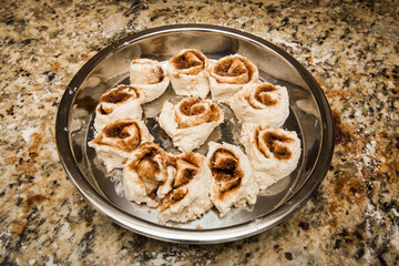 Cinnamon rolls in pan ready to be cooked