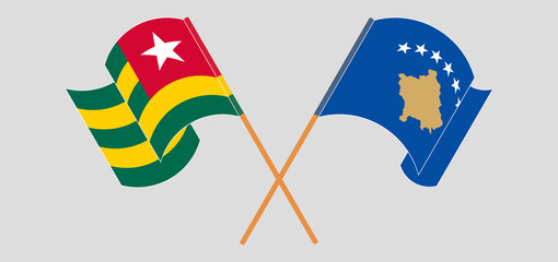 Crossed and waving flags of Togo and Kosovo