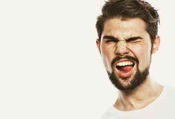 Portrait of surprised bearded man against white background