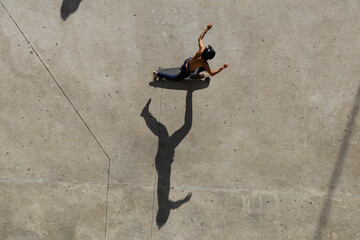 Man rides a skateboard in Roosevelt square, downtown Sao Paulo, Brazil.
