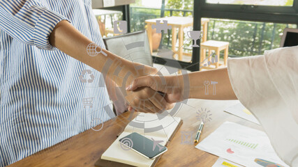 Businessman hand working with computer and team