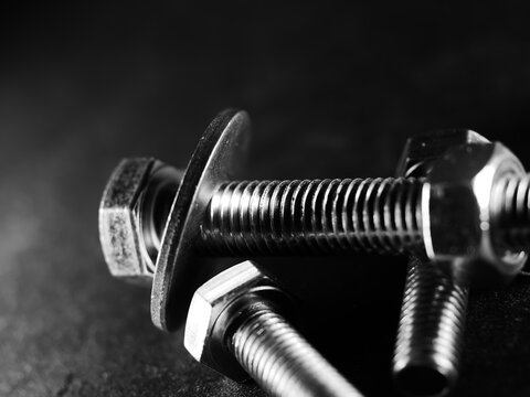 Closeup Shot Of Metal Screw Threads Isolated On The Black Background