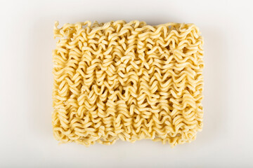 Raw instant noodles on white background.