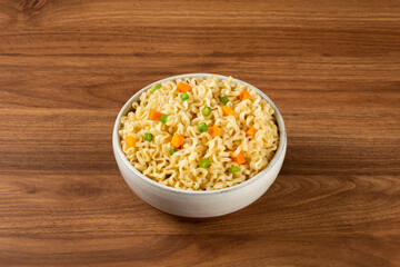 Bowl with instant noodles on the table.