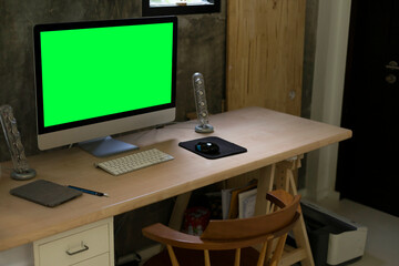 Chroma key screen of computer on table