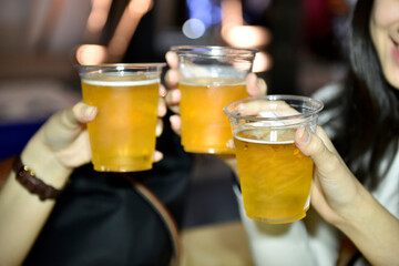 Beer Toasting,Hands holding Glasses of Beer