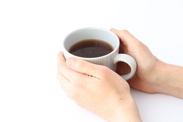 コーヒーカップを持つ女性の手　白背景