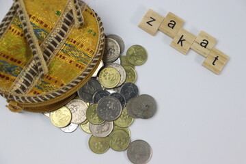 Zakat letters with coins