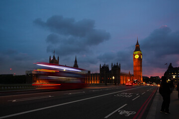 House of Parliament and Big Ben at dusk with its typical tourist movement in London, England.