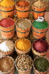 Wooden barrels of colorful spices and lentils in open air market, Philae, Egypt 