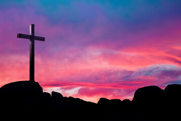 Christian cross over beautiful sunset background