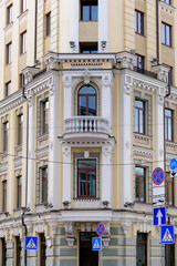 Ornate facade of an old building with road signs in Kyiv Ukraine
