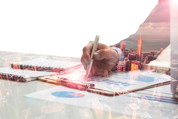 Double exposure photo.businessman hand .Investment manager working new private banking project office.City skyscrapers background.