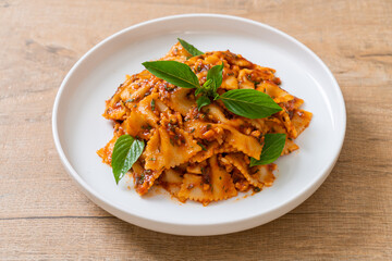 farfalle pasta with basil and garlic in tomato sauce