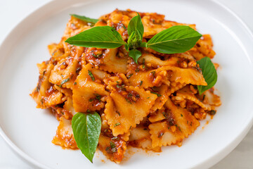 farfalle pasta with basil and garlic in tomato sauce