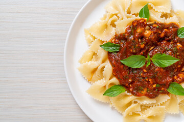 farfalle pasta with basil and garlic in tomato sauce